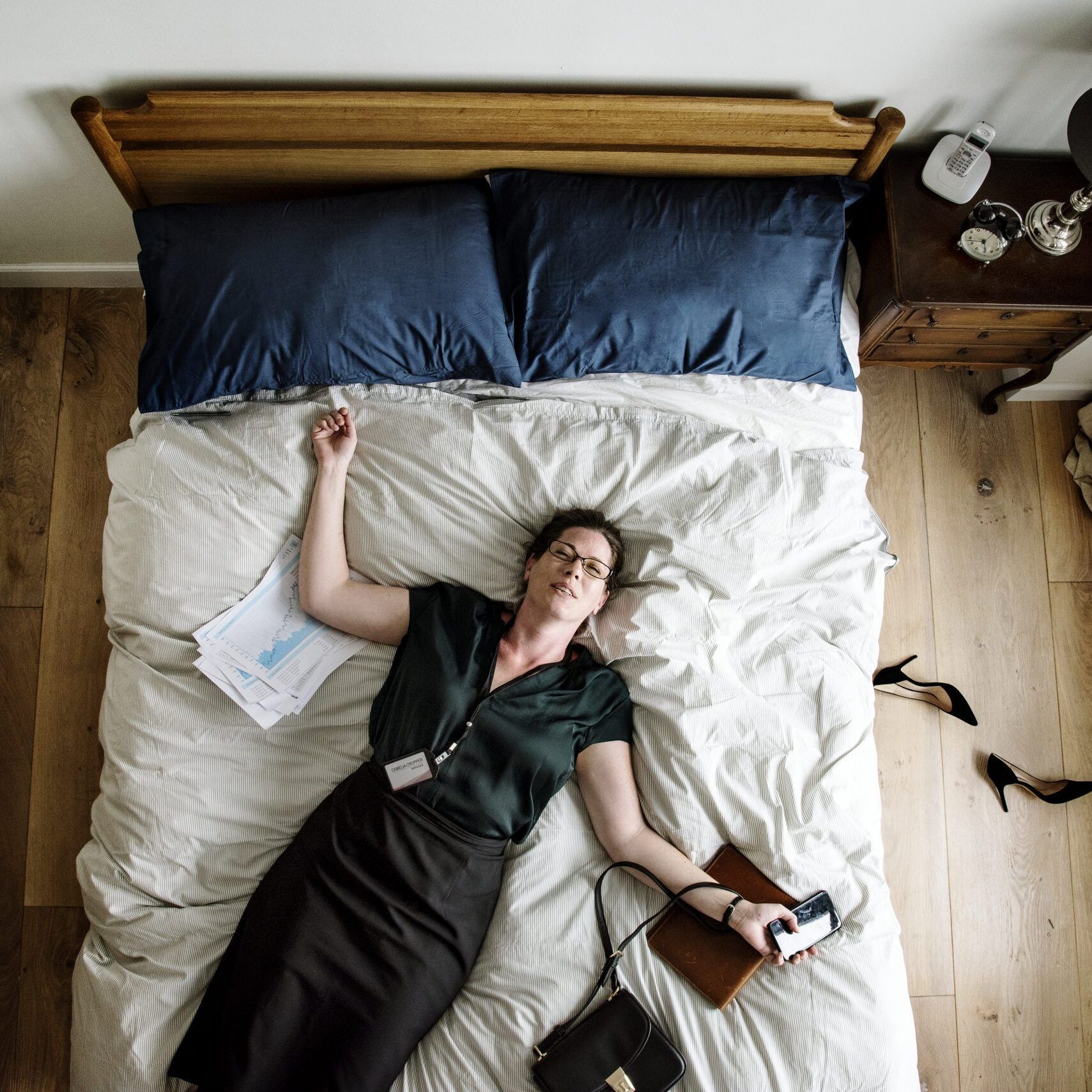 Exhausted business woman falling asleep as soon as she came back home